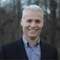 Professional headshot of Paul Hudson, a mortgage broker in Squamish, with a friendly smile and approachable demeanor.